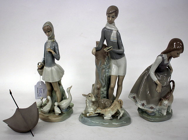 Appraisal: THREE LLADRO PORCELAIN FIGURINES a girl and a cat a