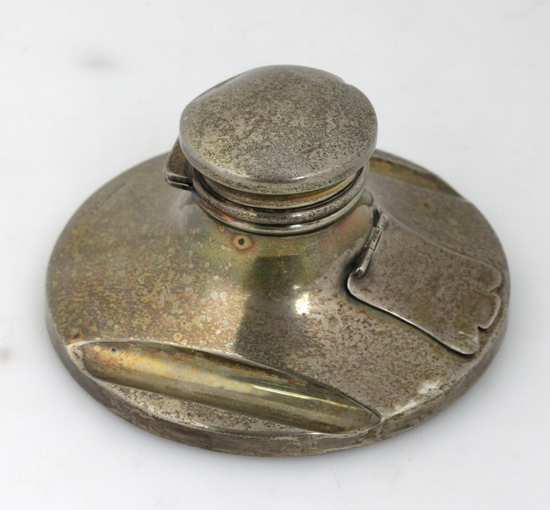 Appraisal: A silver inkwell with integral stamp box Walker Hall Sheffield