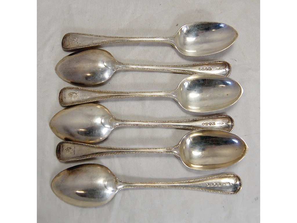 Appraisal: Half-dozen Victorian silver bead-edge dessert spoons bearing crest London maker