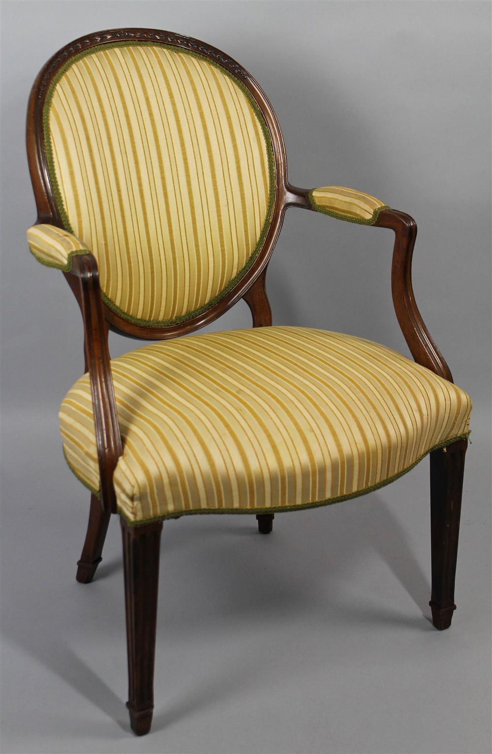 Appraisal: LOUIS XVI STYLE CARVED WALNUT FAUTEUIL having a medallion oval