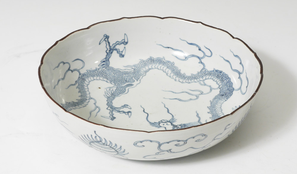 Appraisal: CHINESE BLUE WHITE DRAGON BOWL Scalloped rim interior with blue