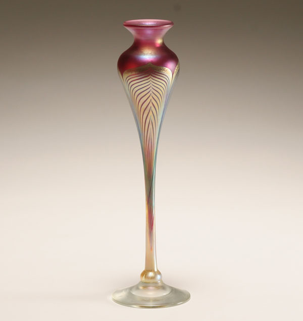 Appraisal: Correia red iridescent floriform studio glass vase Gold feather pulls