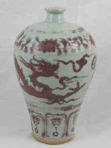 Appraisal: A Chinese pale celadon vase with red brown dragon decoration