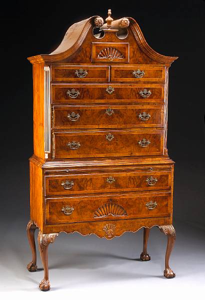 Appraisal: A George II style walnut tall chest on stand partially