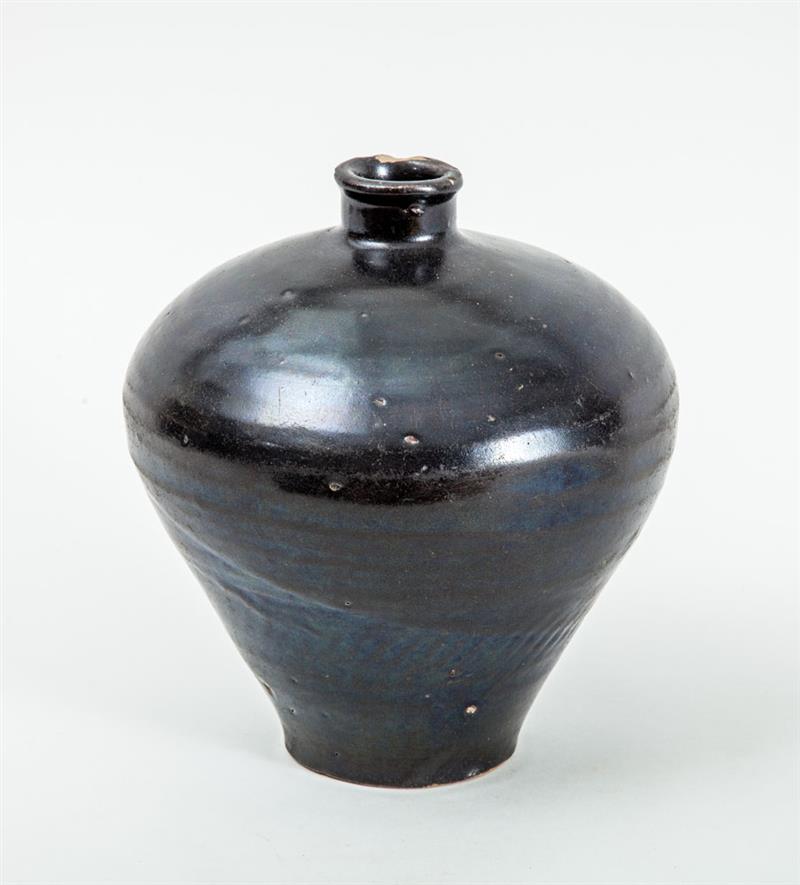 Appraisal: CHINESE SUNG YUAN STYLE BLACK-GLAZED POTTERY JAR The tapered bowl