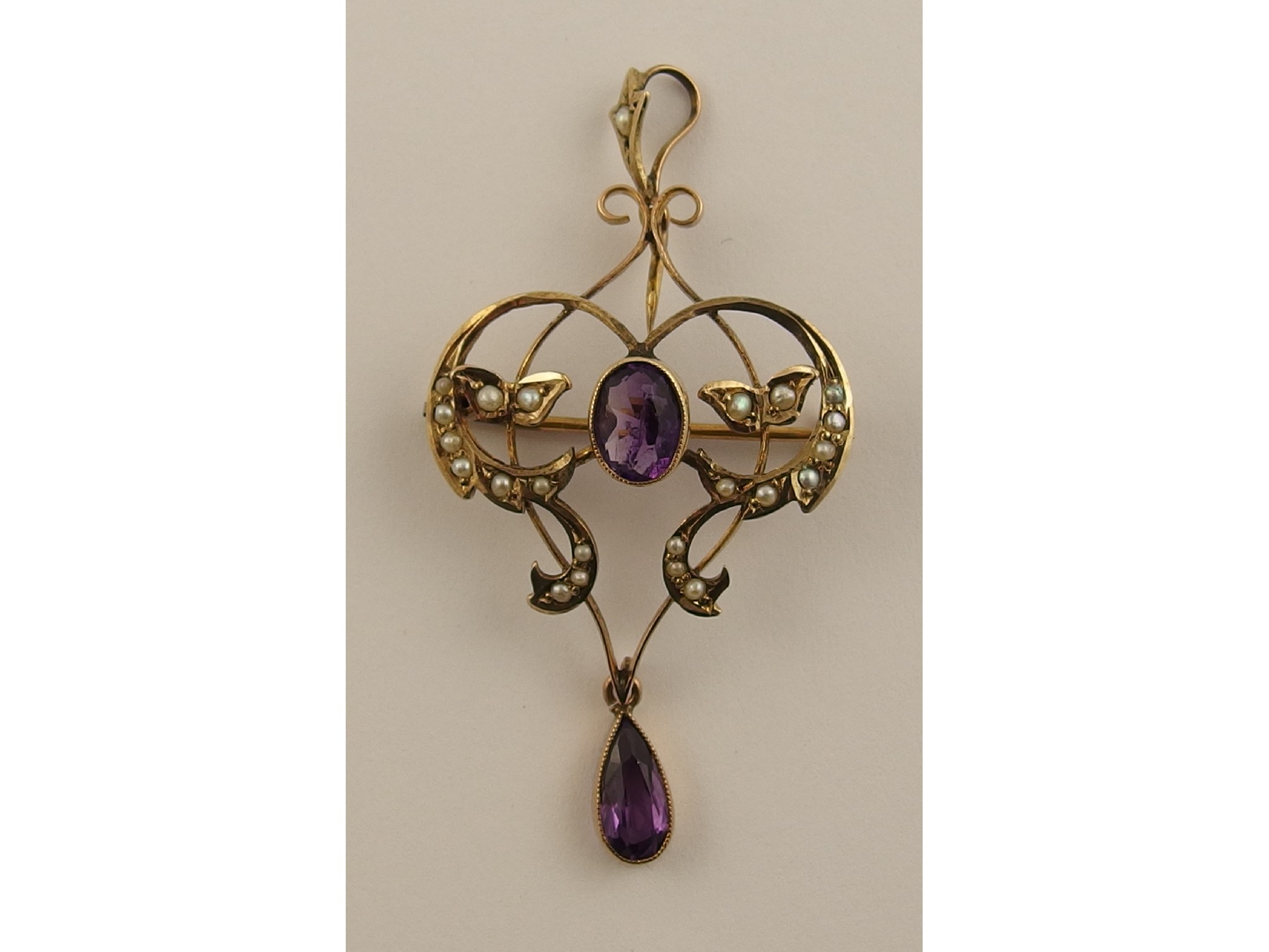 Appraisal: A ct amethyst and pearl set Edwardian pendant brooch