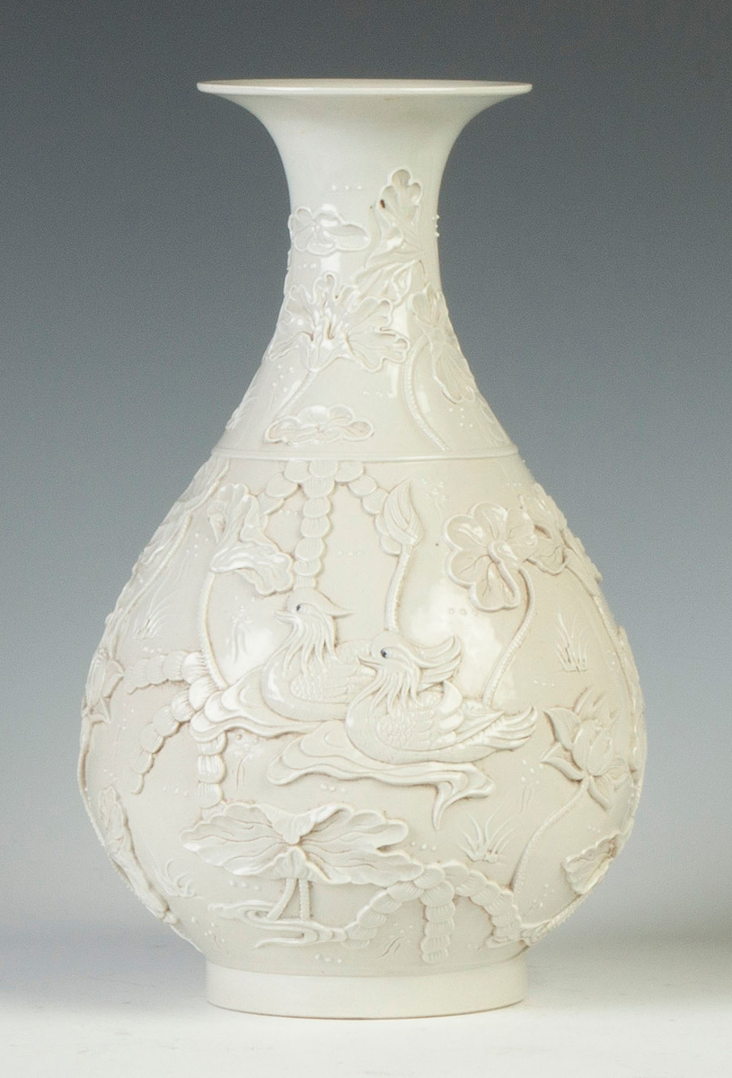 Appraisal: Blanc de Chine Vase Sgn relief water lilies birds