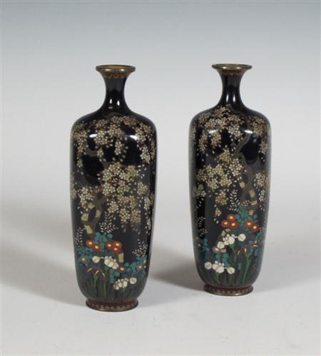 Appraisal: A pair of Japanese cloisonn enamel vases each with flared