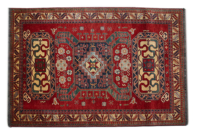 Appraisal: A MODERN KAZAK RED GROUND SMALL CARPET with stylised geometric