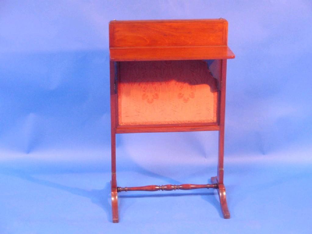 Appraisal: A thC mahogany fire screen with hinged leaf inset fabric