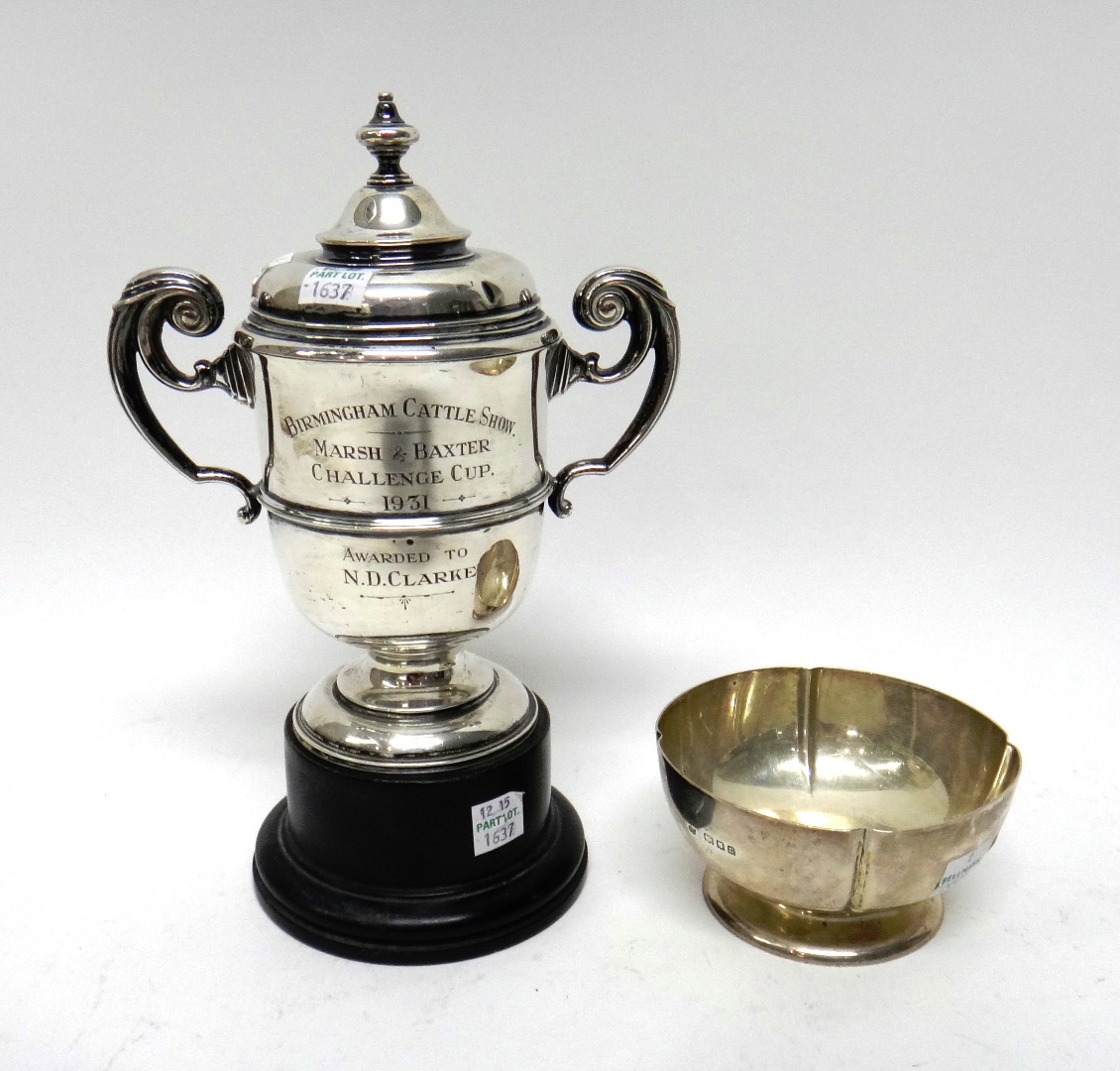 Appraisal: Silver comprising a twin handled trophy cup and cover presentation