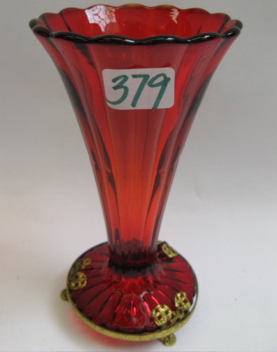 Appraisal: A FLARED RUBY RED GLASS VASE fitted on -footed gilt