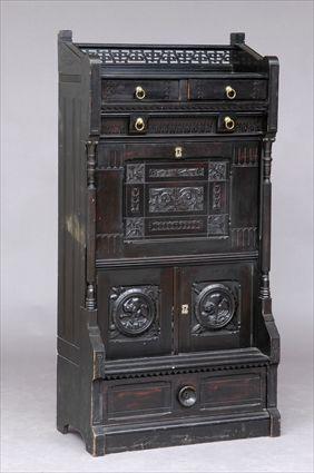 Appraisal: AMERICAN AESTHETIC MOVEMENT EBONIZED AND CARVED FALL-FRONT DESK After a