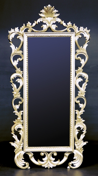 Appraisal: Continental carved silverwood pier mirror scrolling leaf-form surround enclosing rectangular