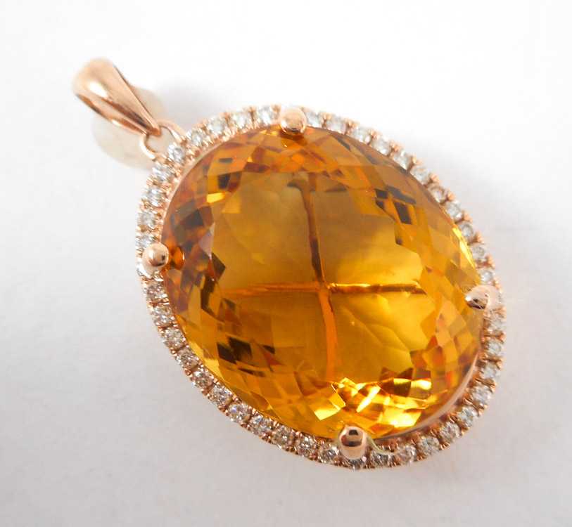 Appraisal: CITRINE DIAMOND AND ROSE GOLD PENDANT The k rose gold