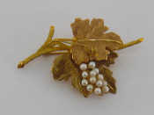 Appraisal: An carat gold and seed pearl spray brooch designed as