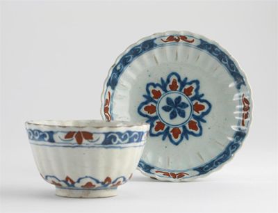 Appraisal: An unusual Delft fluted teabowl and saucer painted in blue