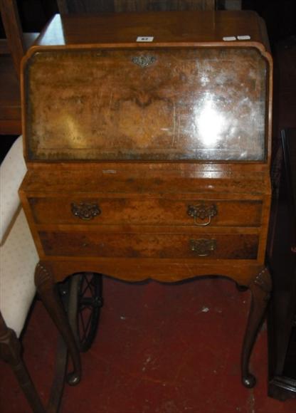 Appraisal: A Georgian style walnut small bureau on carved cabriole supports