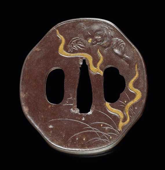 Appraisal: AN IRON HAKKAKUGATA TSUBA WITH GOLD Japan Edo period L