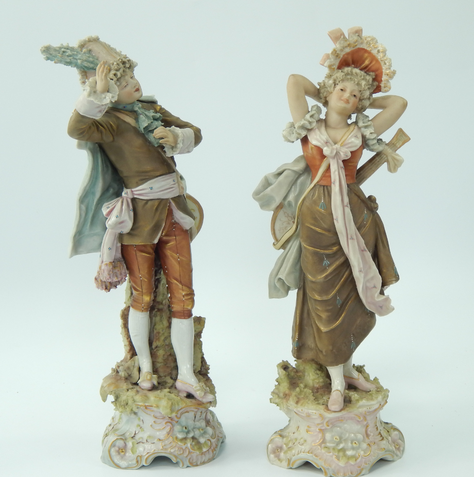 Appraisal: A pair of Royal Dux porcelain figures of a gallant