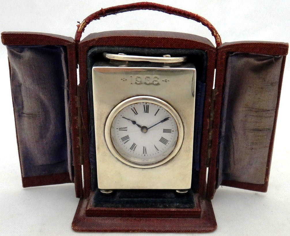 Appraisal: A silver miniature rectangular cased carriage clock time piece with