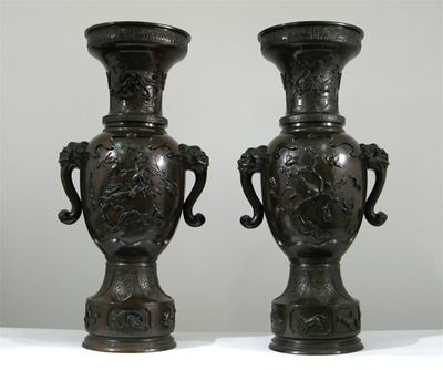 Appraisal: A massive pair of Japanese bronze temple vases each cast