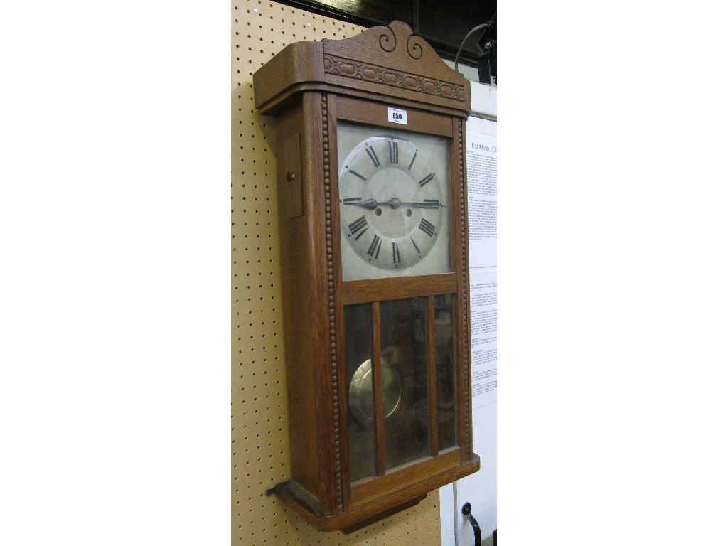 Appraisal: Oak cased wall clock