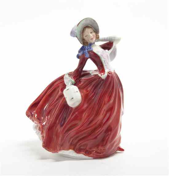 Appraisal: A Royal Doulton Porcelain Figure Autumn Breezes modeled as a