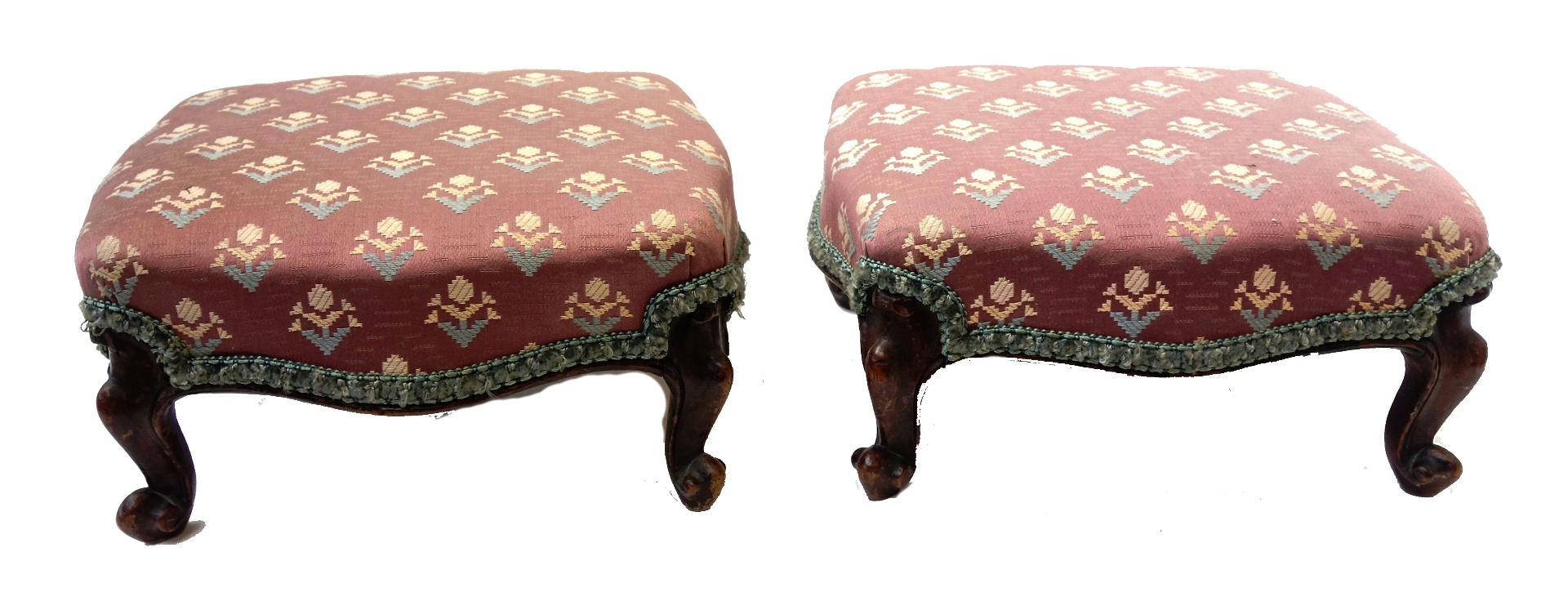 Appraisal: A pair of Victorian walnut framed footstools of serpentine outline