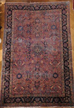 Appraisal: SAROUK GRAPE-GROUND CARPET Worked with floral trelliswork within primary cobalt