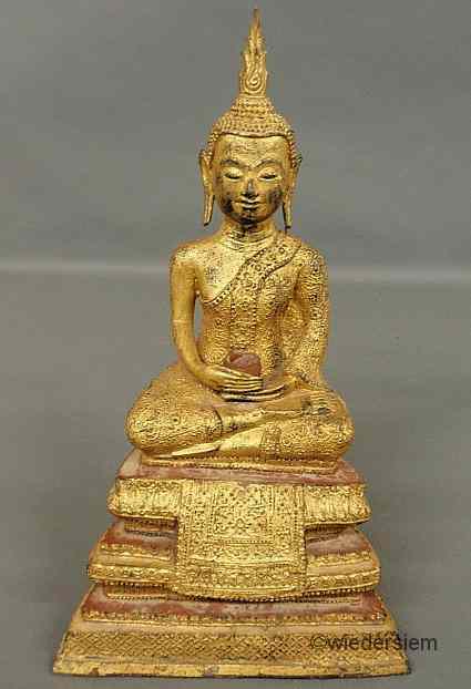 Appraisal: Gilt over metal seated Buddha th c with an earthenware