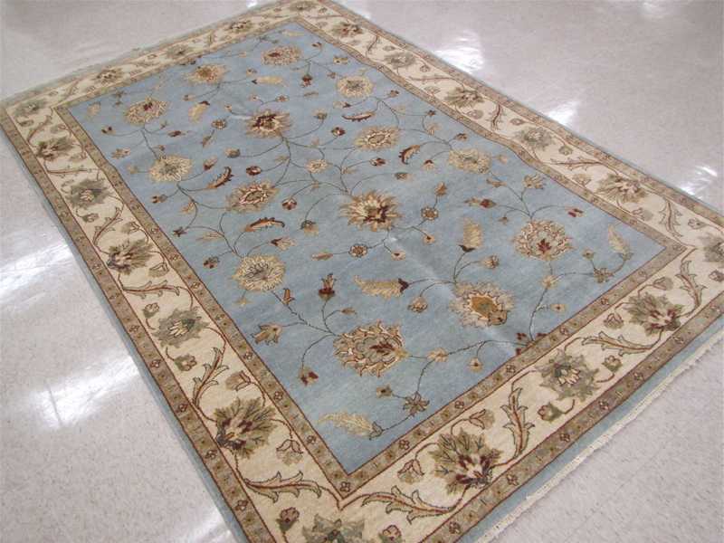 Appraisal: HAND KNOTTED ORIENTAL CARPET Indo-Persian floral Isfahan design on sky