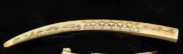 Appraisal: An Eskimo ivory cribbage board With scrimshaw work depicting seal