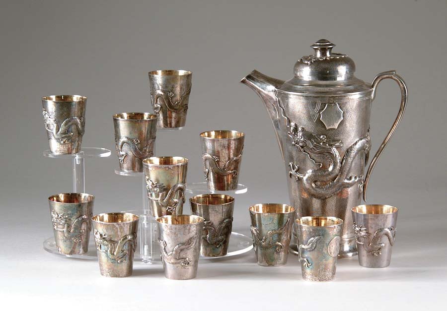 Appraisal: ORIENTAL SILVER BEVERAGE SET Set consists of large silver pitcher