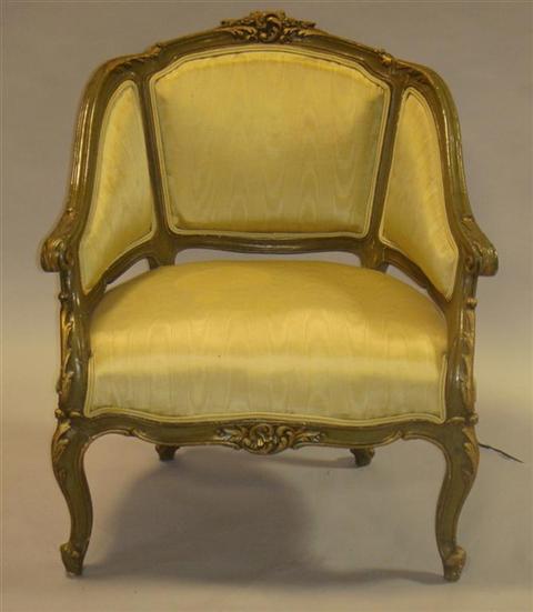 Appraisal: LOUIS XVI STYLE GREEN PAINTED BERGERE the carved crest joined