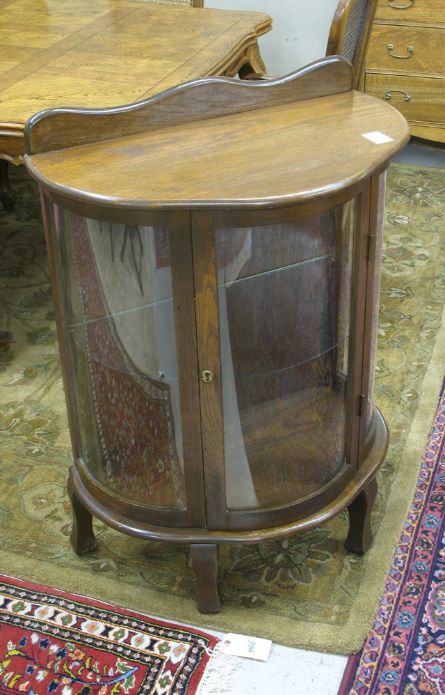 Appraisal: DIMINUTIVE OAK AND CURVED GLASS CURIO CABINET antique reproduction with