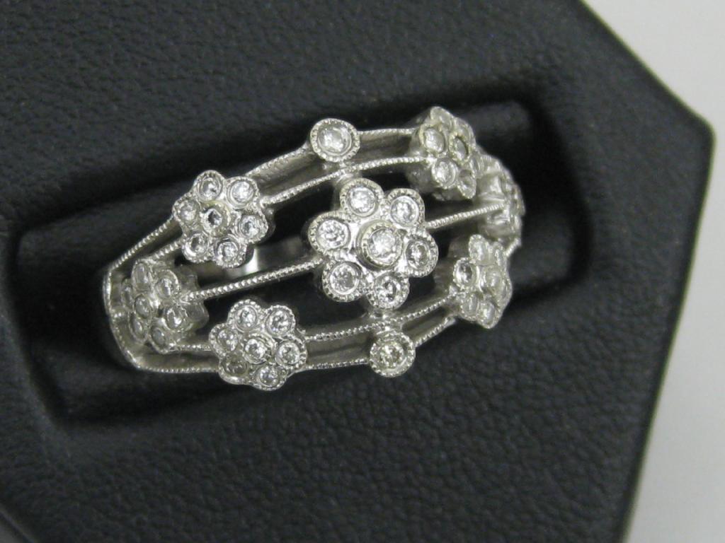 Appraisal: A Continental Diamond Cocktail Ring the brilliant-cut stones collet-set in