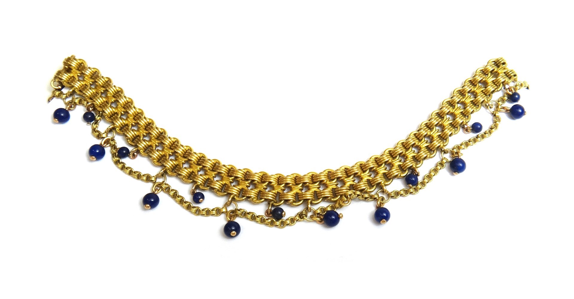 Appraisal: A gold and lapis lazuli bead bracelet in a two