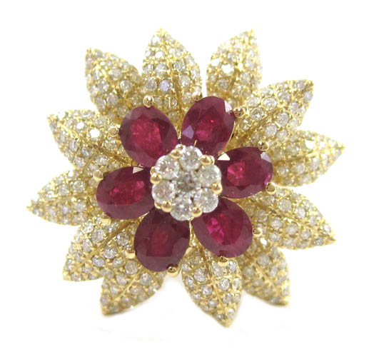 Appraisal: RUBY AND DIAMOND FLOWER MOTIF RING k yellow gold set