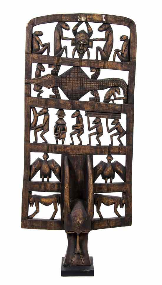 Appraisal: An African Carved Wood Mask with a pierce carved headdress