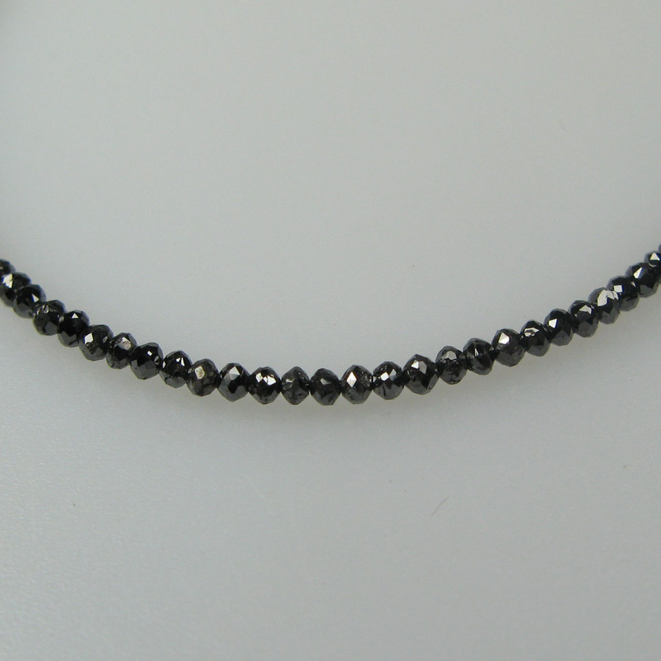 Appraisal: Single Strand Faceted Black Diamond Necklace with a k white