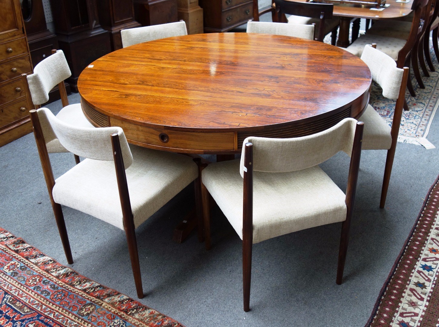 Appraisal: A 's Brazilian rosewood circular dining table designed by Robert