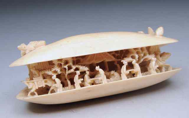 Appraisal: A JAPANESE IVORY CARVING in the form of a clam