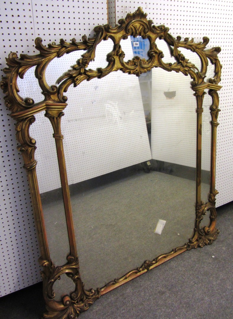 Appraisal: A th century gilt framed overmantel mirror with segmented frame