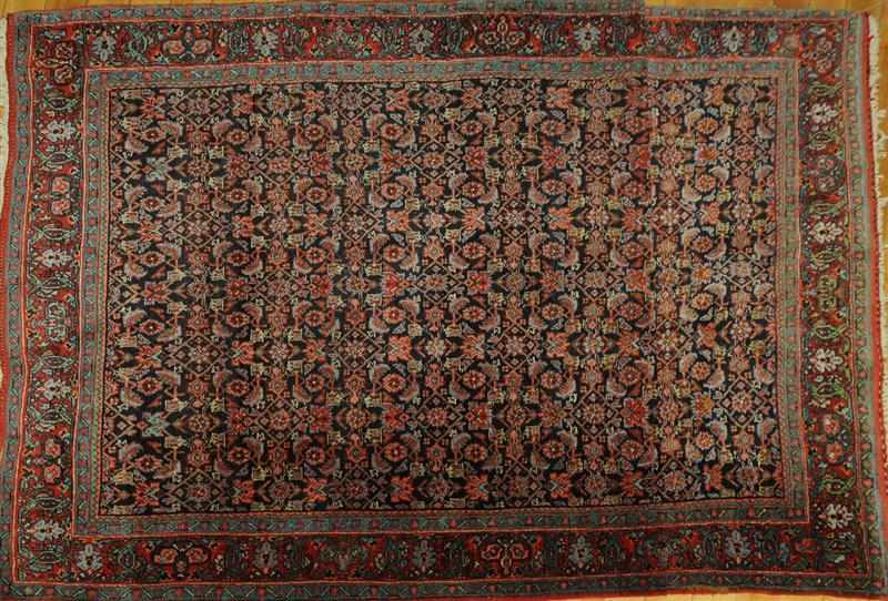 Appraisal: PERSIAN RUG The cobalt field with floral trellis overlay within