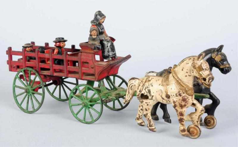 Appraisal: Cast Iron Open Wagon with Amish Figures Modest wear Condition