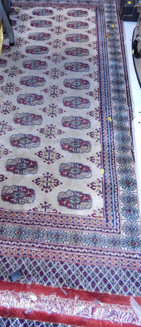 Appraisal: A Shiraz cream ground rug decorated with floral medallions cm