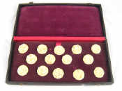 Appraisal: A set of twelve carved ivory buttons with screwed stud