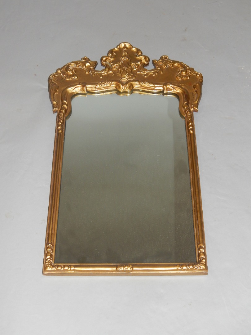 Appraisal: An early thC gilt wood wall mirror with leaf scroll