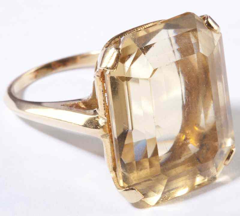 Appraisal: Gold and Citrine Ringcentering on one rectangular and faceted citrine